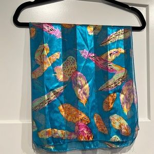 Blue scarf with leaf pattern design. 13” x 60”
